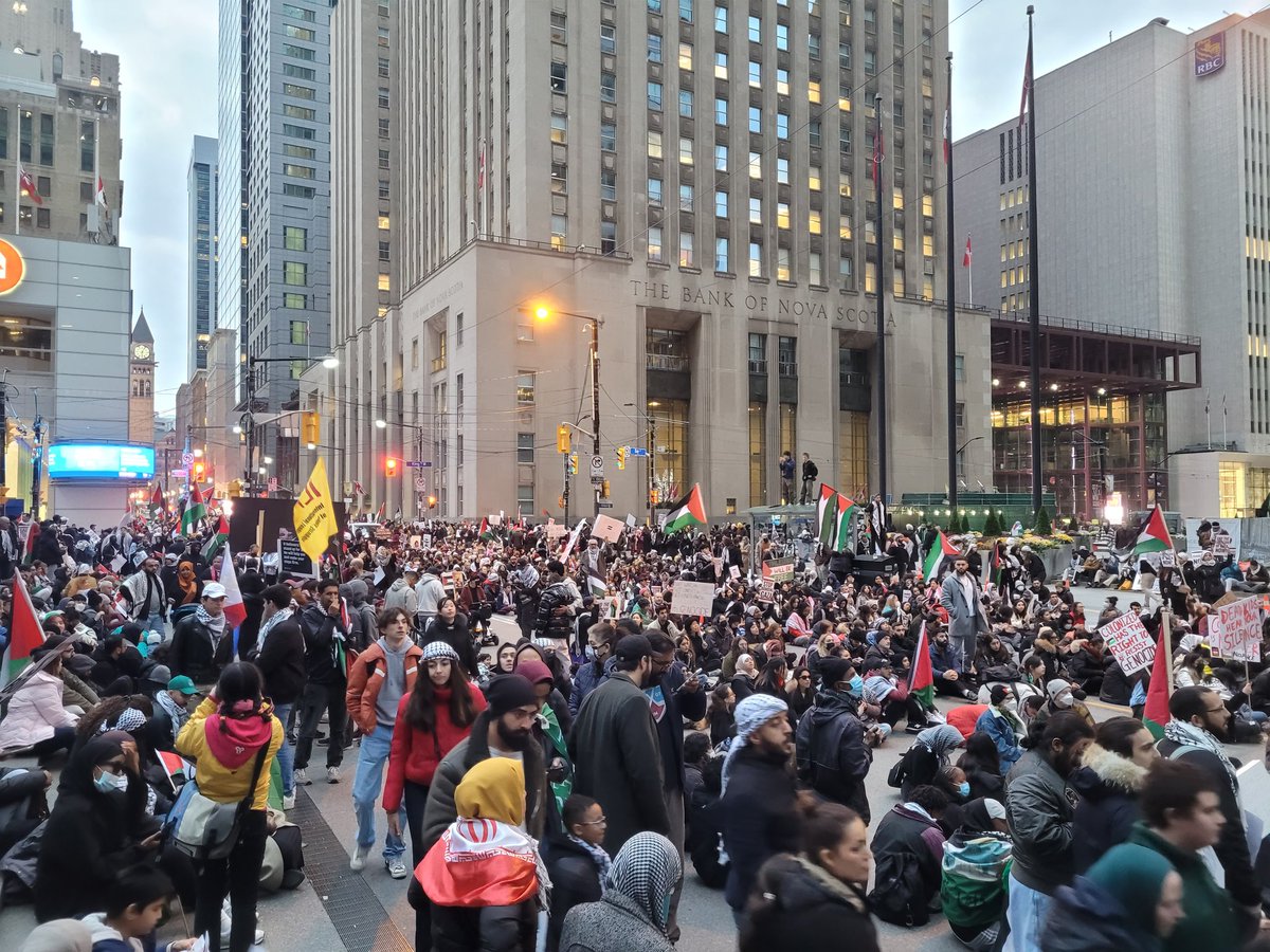 bcohenn's tweet photo. Rally has turned into a sit-in. “We will occupy Toronto and back up these streets for as long as it takes for Toronto to hear us tonight,” a demonstration organizer said. https://t.co/eQTUIgYdb4