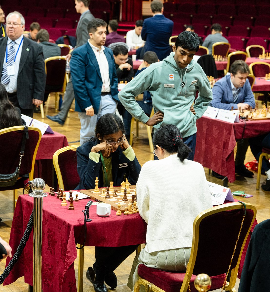 ChessbaseIndia's tweet photo. The moment his game ended Praggnanandhaa immediately went to see the game of his sister Vaishali at the FIDE Grand Swiss 2023. He wanted to check if Vaishali was winning or not. After assessing the position he went to the stands and updated his mother of Vaishali's chances! :) 

Photos by @photochess (she is always there catching the important moments!)

#chess #chessbaseindia #FIDEGrandSwiss