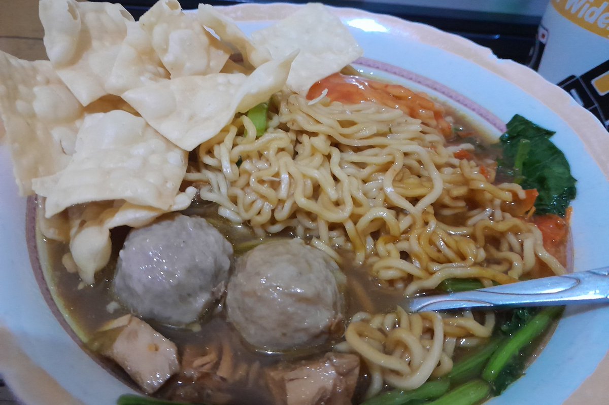Chicken noodle with meatball and fried dumpling cracker with spicy hot sauce. 😍