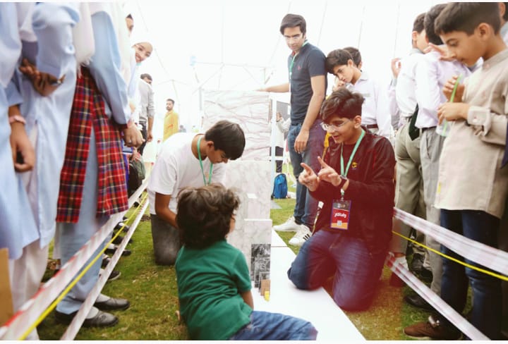 KSSPakistan's tweet photo. Heroes of LSM (2)
At LSM 23, Hunain, Abdul Rehman, and Hashim wowed spectators with their 300 kg domino experiment. They worked with the biggest blocks without any breaks. The sound of their heaviest block falling, resonated the mela with life. Thank You!
-@dr_Mustafa_Z 
#KSSLSM https://t.co/h9jYad5zC7