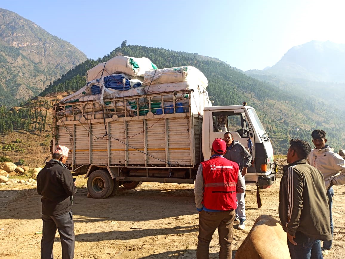 ifrc's tweet photo. @NepalRedCross teams immediately swung into action. So far, they’ve distributed 1,500 tarpaulins, 1,500 blankets, 1,700 mattresses, 200 buckets, 800 rolls of rope and 250 body bags to the two most-affected districts. https://t.co/18FqRSBbNP