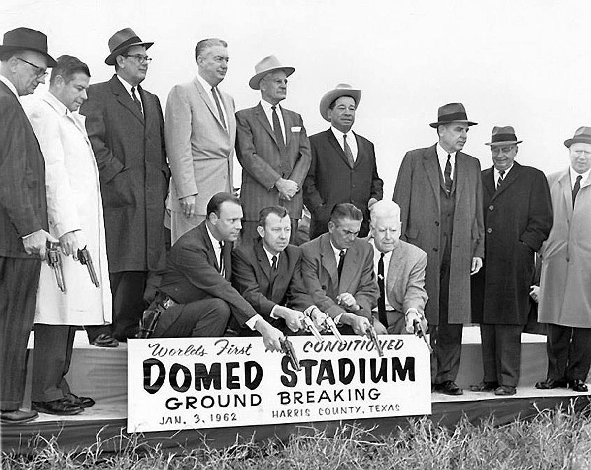 Groundbreaking ceremony for the Houston Astrodome, 1962.  The men have pistols in their hands because the baseball team that the dome was to host was called the Colt 45s. It was originally called the "Harris County Domed Stadium."  The base of the structure covers 9.14 acres.