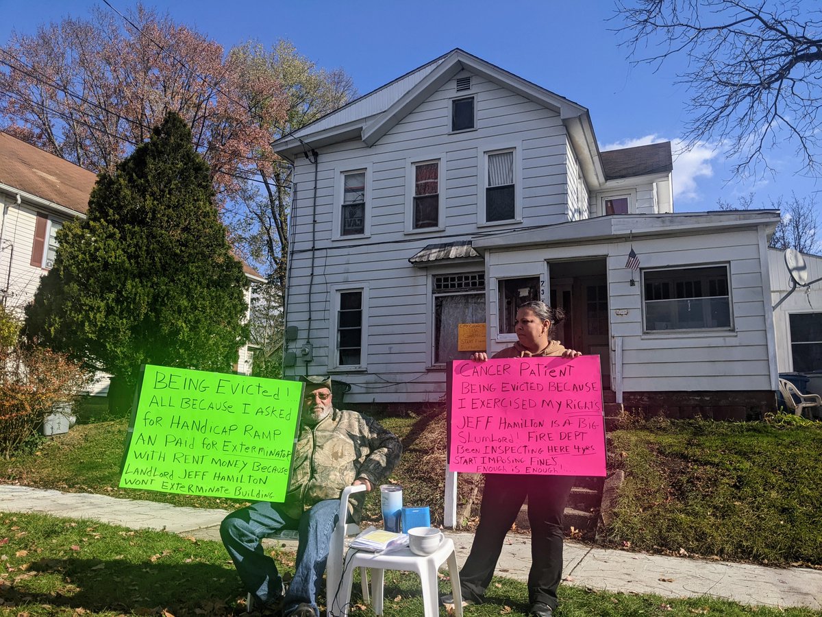 Protest today at an apartment house on Park Ave near Randolph. Bob Hanna (left) recently addressed Meadville City Council regarding conditions at the residence. Today he said he is withholding rent for repairs and extermination costs and now faces eviction.