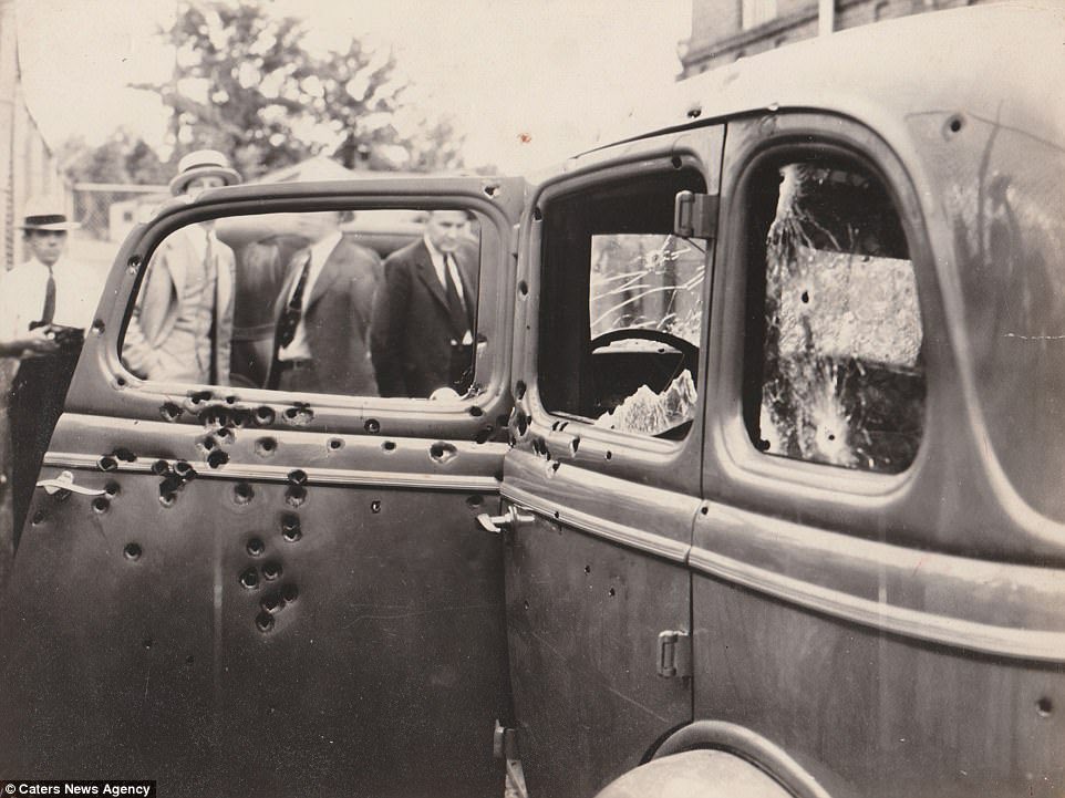@Morbidful A new picture of an affectionate embrace between Bonnie and Clyde has emerged showing the murderers shortly before they met their gruesome end.

Bonnie Parker and Clyde Barrow met in Texas in 1930 and are believed to have committed 13 murders and several robberies and burglaries