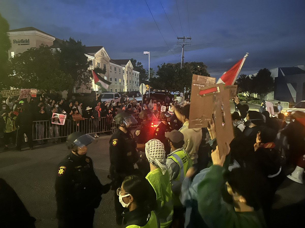 protest outside Friends of the IDF gala in San Carlos is over 1,000 police have split group in two & created a corridor for gala attendees to drive into museum where it’s being hosted as each car comes in, crowd chants “shame on you”