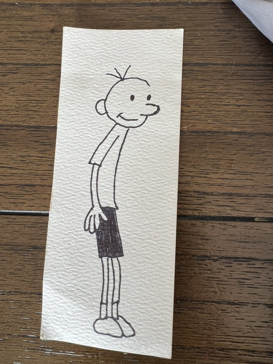 Kurtis19's tweet photo. @wimpykid @wimpykid 

Ok Santa did a bad thing and totally plagiarized your work.

Ezra asked Santa for your autograph and he obliged. 

We’re coming to see you on tour in Washington tomorrow. He might put you on the spot and ask you about it 🫣🫢. Hope you see this message in time! https://t.co/yq0GBLOqUh