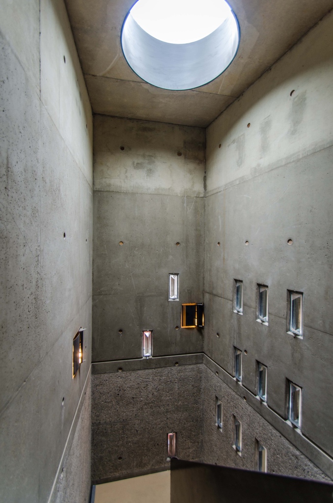 qocatecture's tweet image. Archive - Walmer Yard - London, England _ The #concrete stairwell of House #2 with solid cast glass triangular #decklights, providing #refractive #light. Good times in the concrete pit. #petersalter #qoca #qocatecture #architect #architecture
