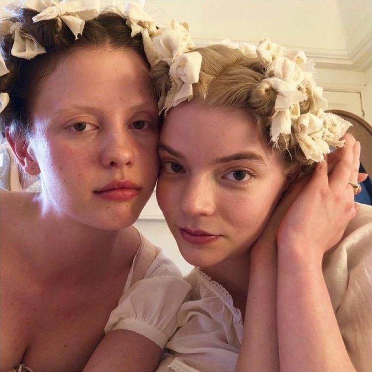 mia goth and anya taylor-joy on set of emma, 2020