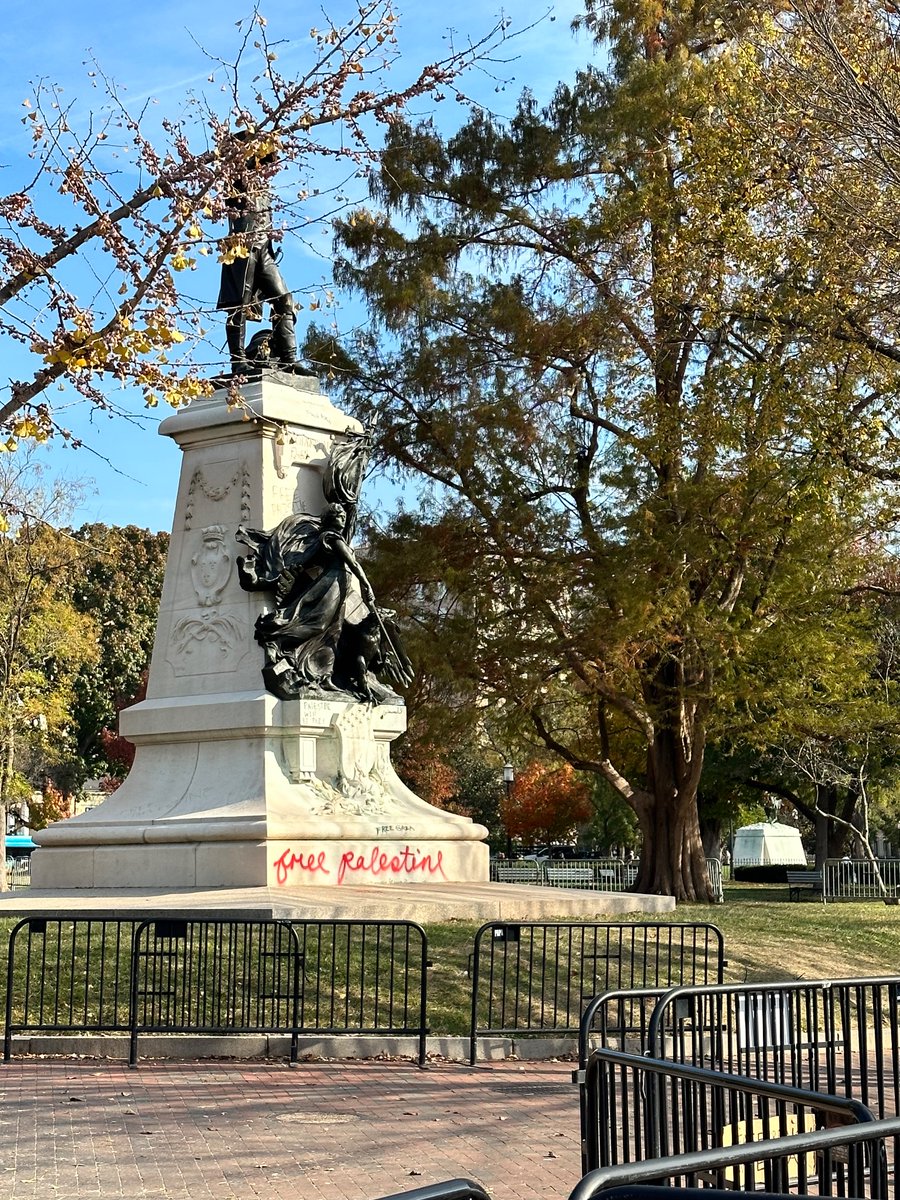 Outside of the White House this morning - red handprints on the gates and “Free Palestine” spray painted on a statue