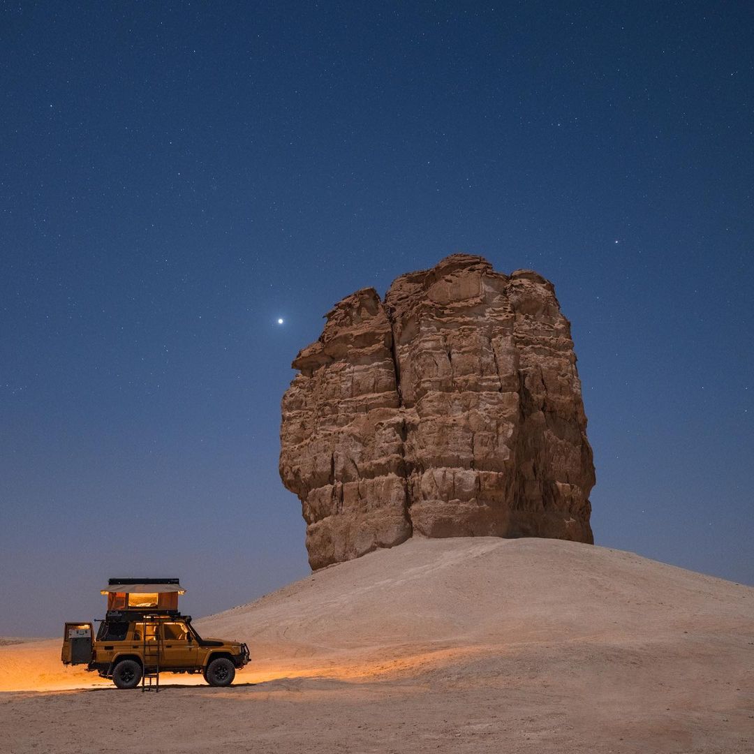 VisitSaudi's tweet photo. If you are looking for the perfect spot for camping under the starry sky, you might want to check out the rock formation of Judah, a unique structure standing tall in the desert of the Eastern Region.🌟

 📸by @danyeid

#VisitSaudi #Dammam https://t.co/DitBsmOWSi