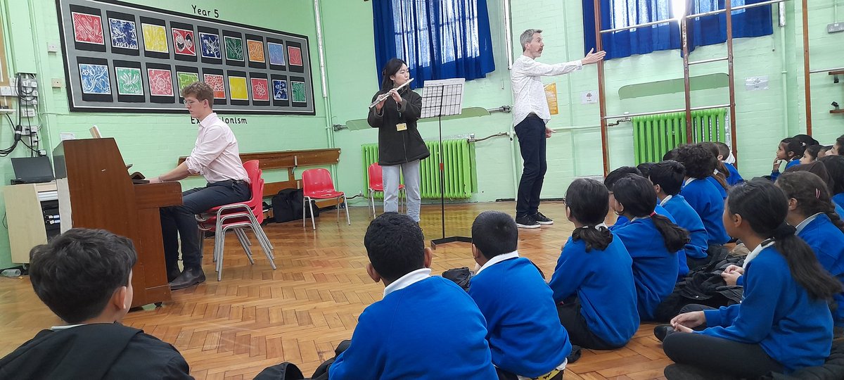 WillGreenMusic's tweet photo. Two musical assemblies this morning featuring students from @RoyalAcadMusic The children listened intently to the flute and the piano. Beautiful music. Thank you @mrjulianwest for helping to make this happen. About 400 children experienced high quality live music today. https://t.co/9zmOXU96TK