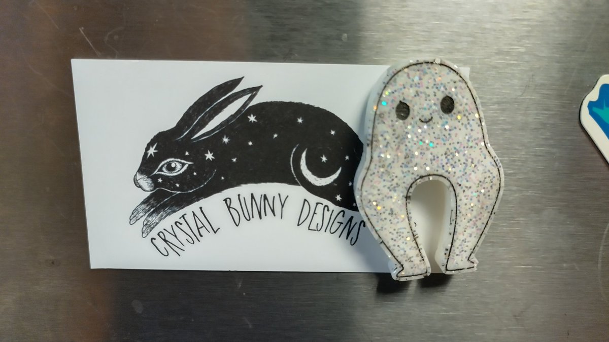 CorneliusPixelC's tweet photo. I forgot about this little guy! He comes from https://t.co/FeBMNC6gSX, who was the next vendor past the nice candle lady (and iirc they knew each other?).

Look, you make Fresno Nightcrawlers merch and I'm in. Love the pants cryptid. https://t.co/OlMU1FCqxZ