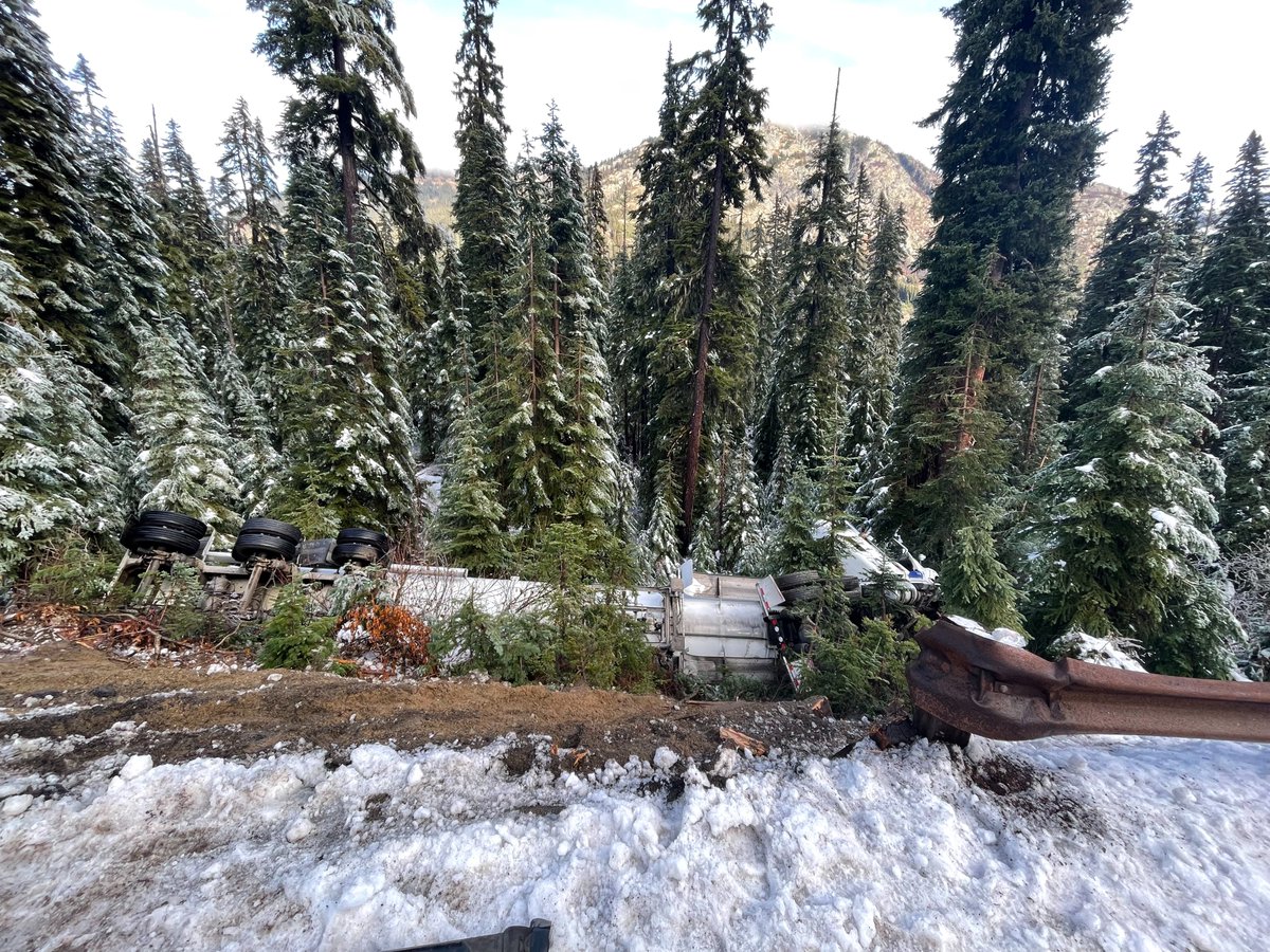 WSDOT_East's tweet photo. Scenes from SR 20 North Cascades this weekend where a tanker went off the road on Rainy Pass. The retrieval was tricky and included an overturned tanker with 11,000 gallons of fuel, and three 40 ft. tow trucks on a 35 ft. roadway. Incredible work by tow crew and maintenance team. https://t.co/eLWYpchXCC