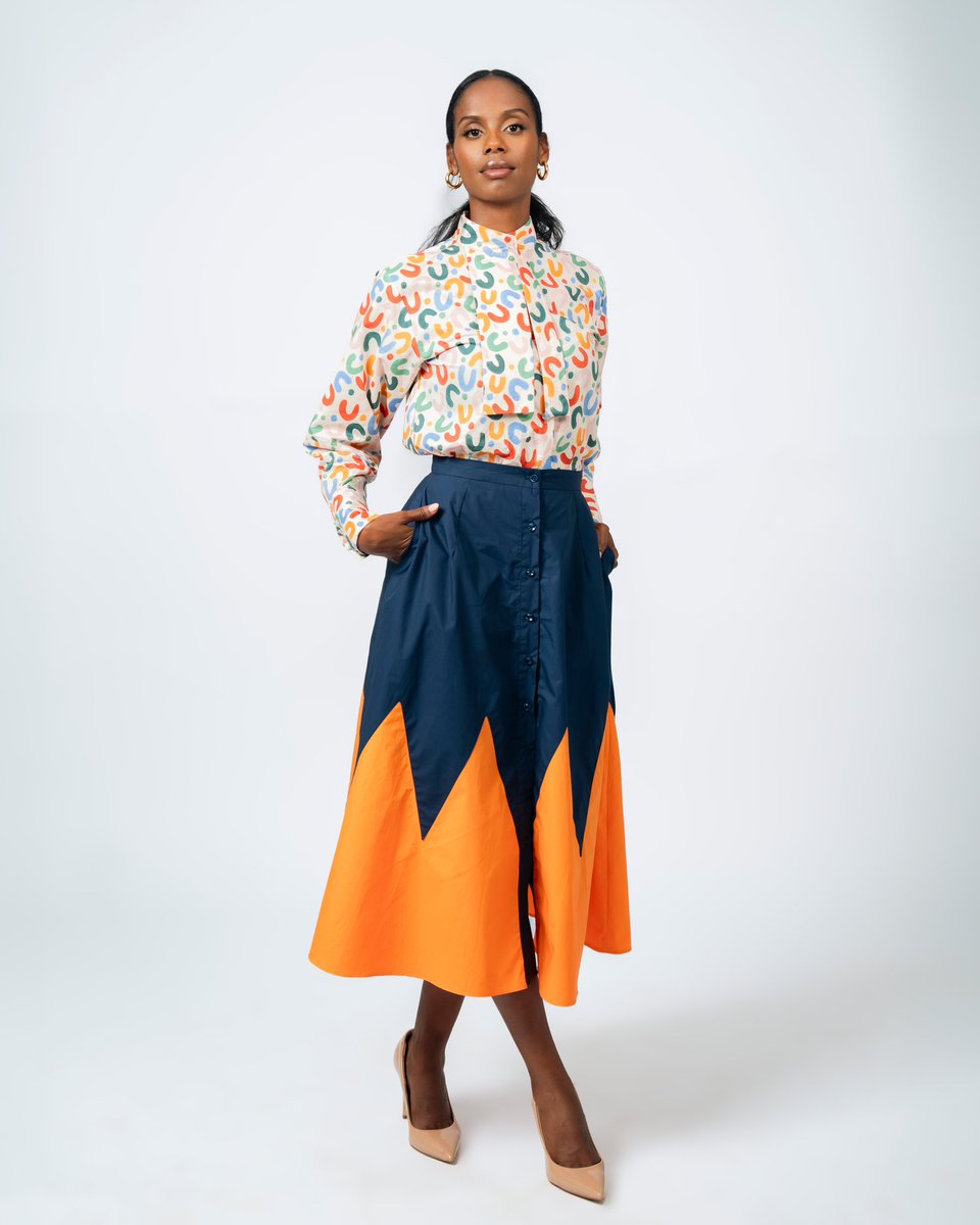 soniamugabo's tweet image. The “Toni” Set features a cotton neck tie shirt in a playful print, paired with a two-tone swing button skirt in navy and orange.

#soniamugabo #Xcollection #fashion #madeinRwanda #africanfashion