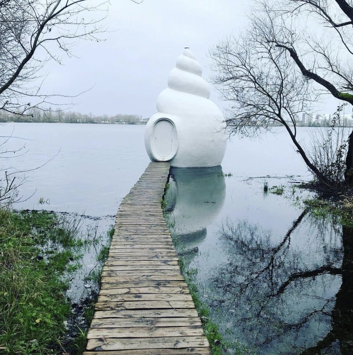 The stunning Neptunea shelter is located on the edge of a secret cove at Lac de Bordeaux Bruges In our imaginations, it connects 2 worlds: the opaque animal shell hints at a life beyond that can’t be seen & this ambiguous relationship between a protective shell & a fragile mass