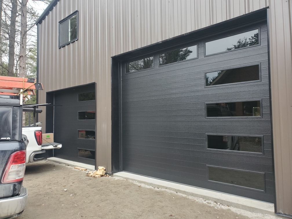 auroraohd's tweet photo. New install CHI model 2348 Black Modern with Tinted Glass #chioverheaddoors #chidoors #auroragaragedoors #garagedoorsaurora #auroraoverheaddoor https://t.co/HgqQgQorSR