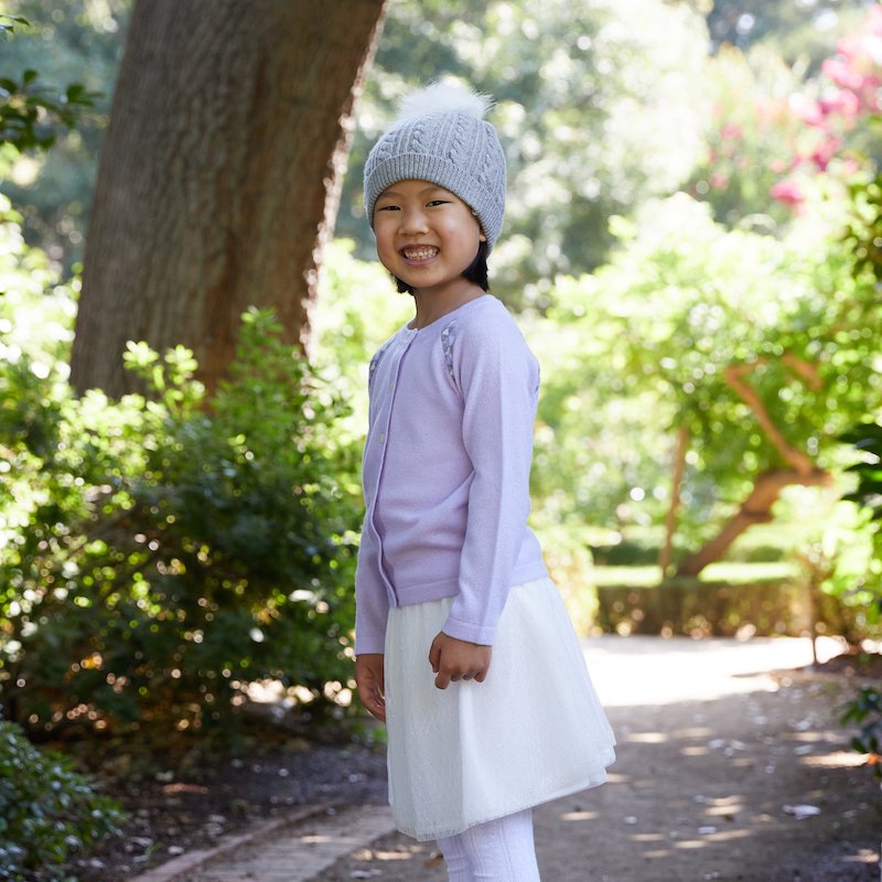 #CUTE as a button 💜Miss S in our Sadie #cashmere cardigan + Gemma sparkle #tutu skirt.
And the Everly pom pom hat just tops it off 😍 edenandzoe.com/collections/gi… #fashion #style