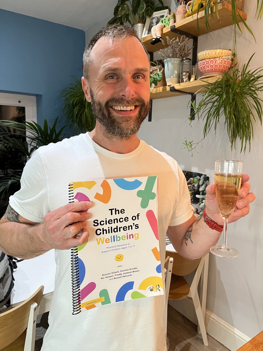 Duncanjee's tweet photo. Finally I get to physically hold our new book (& a glass of champers) which includes 36 step-by-step sessions for doing #DNAV & #ACT work with young people in & beyond the school context. Thanks & congratulations to my co-authors including nichooper7 @CorinnaGrindle https://t.co/5b20BIG7Vw