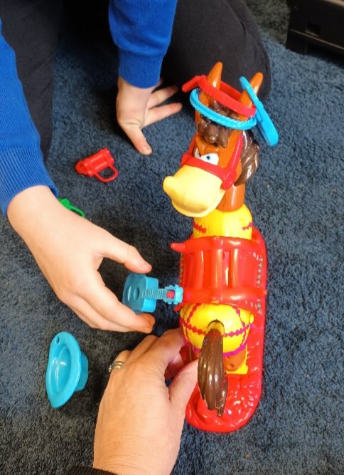 One of the (many) perks of being an EMHP is getting to play! Using Buckaroo to show the effects of too many worries.