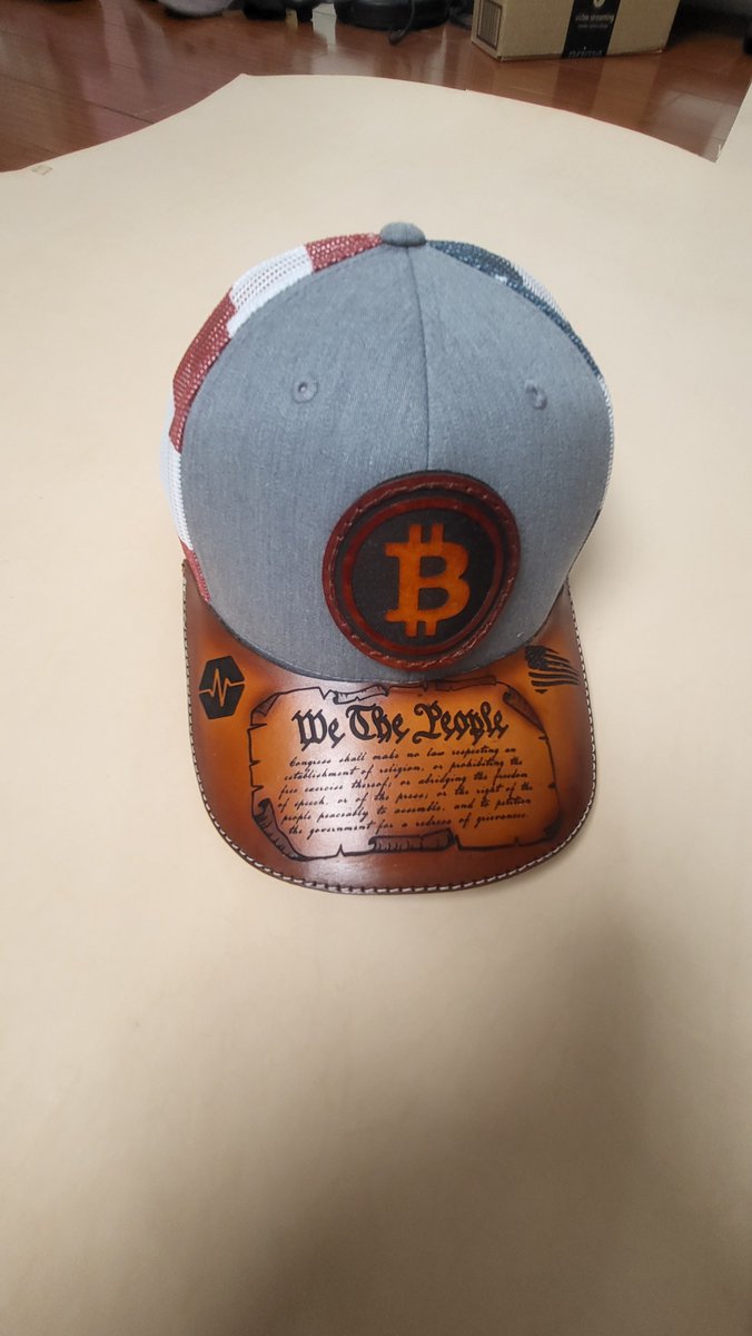 Marcology1776's tweet photo. Thanks for the love the folks showed for this!

I'm getting a few DMs with questions on how it's made.

No, the hat doesn't come with the leather on the brim. 
This is 100% handmade, and you can't buy it anywhere.

1. I cut a piece of leather from a Full Leather hide.
2. Then I engrave that leather.
3. Then I airbrush the color on it.
4. Then I glue/sew the leather brim on the hat.
5. Then I polish and coat the leather and finish off the Velcro for the patch.

I'll make a video soon! 
(One mistake and the hat is ruined!!!😱)

#PulseChain #FirstAmendment #LeatherCraft #Crafting #FreedomOfSpeech