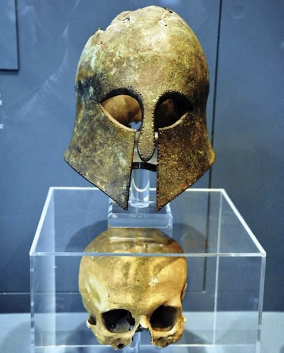 historyinmemes's tweet photo. Corinthian helmet found with the soldier's skull still inside from the Battle of Marathon, which took place in 490 BC during the first Persian invasion of Greece.

More than 2,500 years ago, on the morning of September 12th, 10,000 Greek soldiers gathered on the plains of Marathon to fight the invading Persian army. The Greek soldiers were composed mostly of citizens from Athens as well as some reinforcements from Plataea. The Persian army had 25,000 infantrymen and 1,000 cavalry.

The outnumbered Greeks had stalled for days, hoping reinforcements would arrive from Sparta. But alas, they could not wait any longer. The Persians, expecting an easy victory, waited patiently as the Greeks began to push forward. At this point, the two armies were at "a distance not less than 8 stadia" (approximately 1,500 meters).

As they got closer, the signal was given to the Persian archers to fire their arrows. The Greeks picked up speed in the final 400 meters, undeterred by the hail of arrows that filled up the sky. Within minutes, the two armies were on top of each other. The Greek wings overpowered the Persian soldiers on the flanks, which allowed them to quickly surround the center of the Persian army. Panic ensued, and the Persians began fleeing back to their ships. Some of them, unfamiliar with the terrain, retreated towards the swamps where an untold number of them drowned. According to the Greek historian, Herodotus, 6,400 Persian bodies littered the battlefield. The Athenians lost 192 men, and the Plataeans lost 11.

According to legend, a long-distance messenger by the name of Phidippides was sent to Athens shortly after the battle to relay the news of victory. It has been said that he ran the entire distance from Marathon to Athens, a distance of approximately 40 kilometers (25 miles), without stopping, and burst into the assembly to declare, "We have won!" before collapsing and dying. This story differs quite a bit from Herodotus' account, which mentions Phidippides as the messenger who ran from Athens to Sparta, and then back, covering a total distance of 240 km (150 mi) each way.
