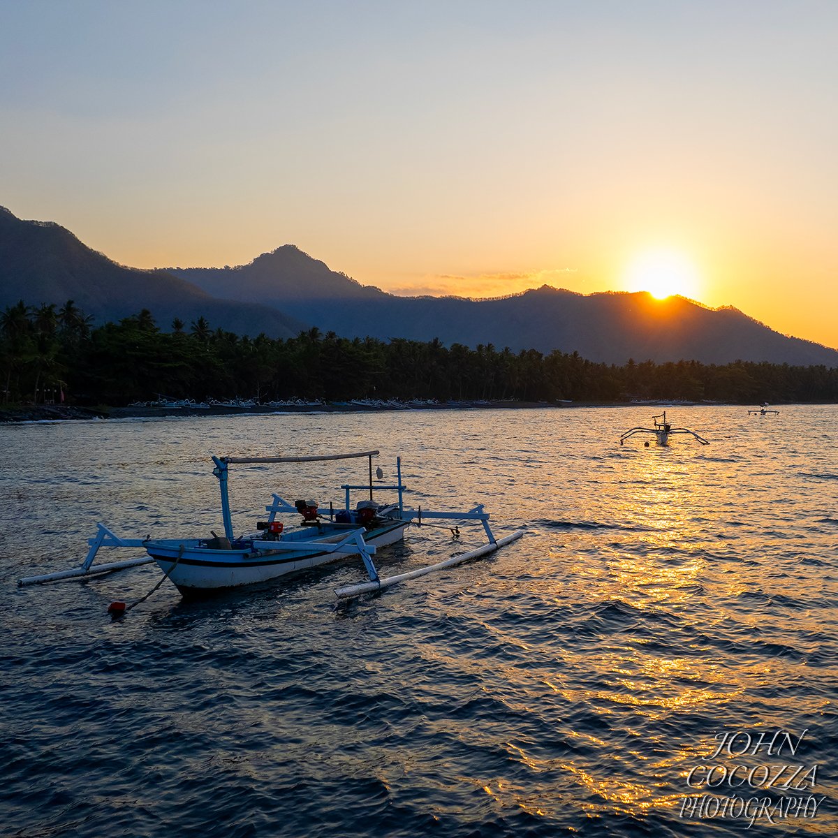 The first evening at @desasaya, I took the drone out to capture the sunset over the North Bali mountains.  Loved using the local fishing boats in the composition. 
.
#bali #desasaya #yogaretreats #reachyogasd #travel #adventure #travelphotographer #balinorthcoast #balisunsets