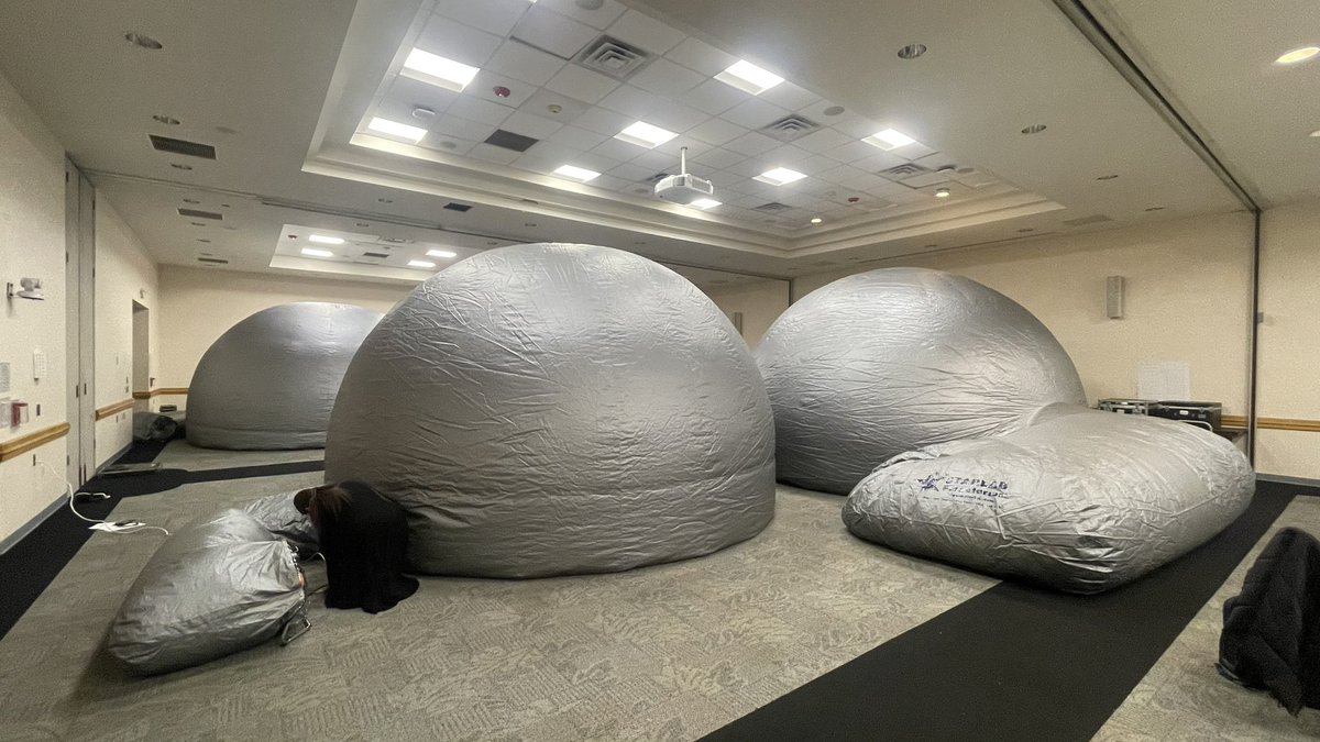 And this is what it looks like when our four Starlabs are all inflated and set up. Six teachers inside each dome are doing a scavenger hunt of the winter, spring, and summer skies.