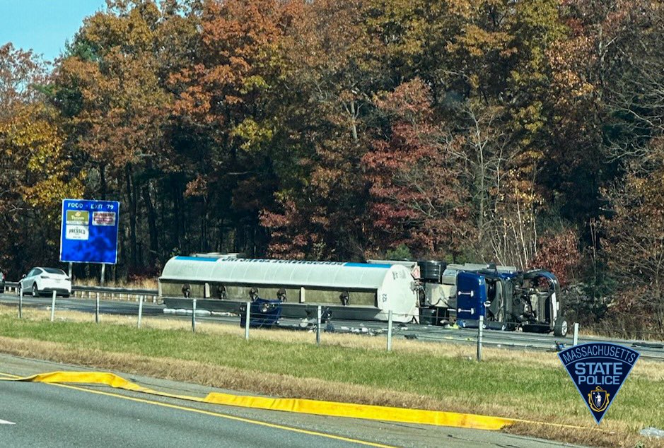 Fuel tanker truck on its side after crashing.