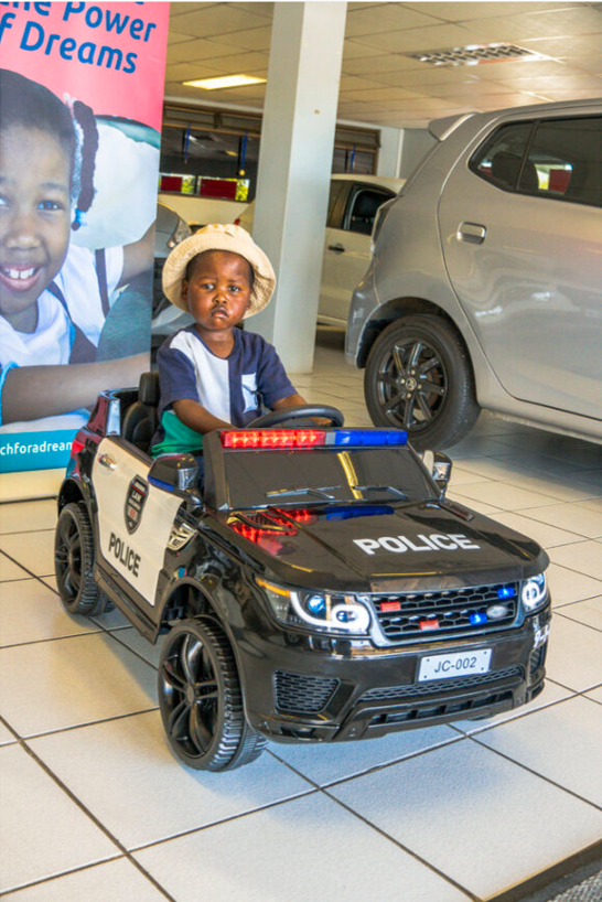ReachForADream's tweet photo. 3-year-old Soyama from East London dreams of being a policeman & riding in a car. ๐ We teamed up with a local dealership to surprise him with his own ride-on police car! His joy is a reminder that happiness lies in simple things. ๐ #LittleDreamsBigJoy #FuturePoliceman #Hope https://t.co/GZGlGTCs5K