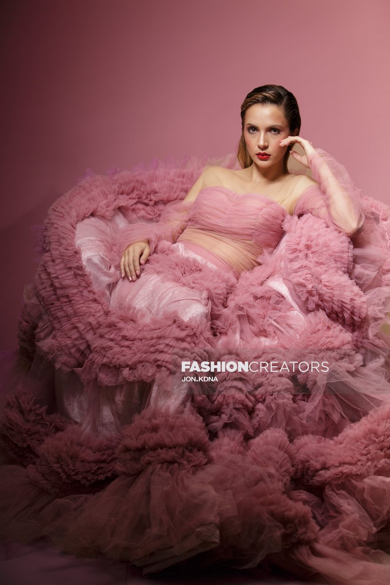 "Captivating in every stride, a model elevates elegance in a stunning haute couture gown. ✨👗 Fashion becomes art in every fold and detail. 💃✨ #Fashion #HauteCouture #Elegance" -