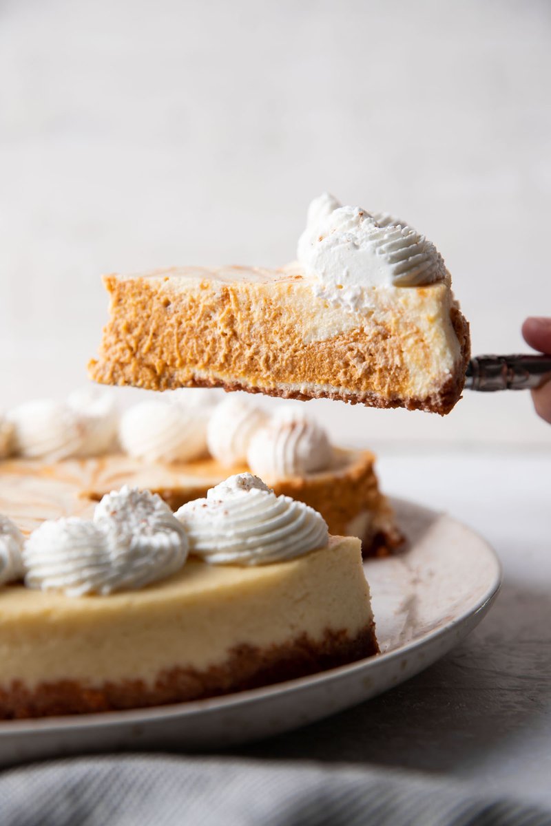 This delicious pumpkin swirl cheesecake will quickly become a household favorite and yearly Thanksgiving dessert tradition! It's rich and creamy, with delicious pumpkin pie flavors and a buttery graham cracker crust. Top it with whipped cream.  
RECIPE: moderncrumb.com/best-pumpkin-s…