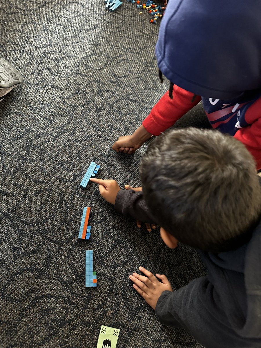 Working with friends to find the product of multiplication equations! I love seeing this team work so well together! 💙