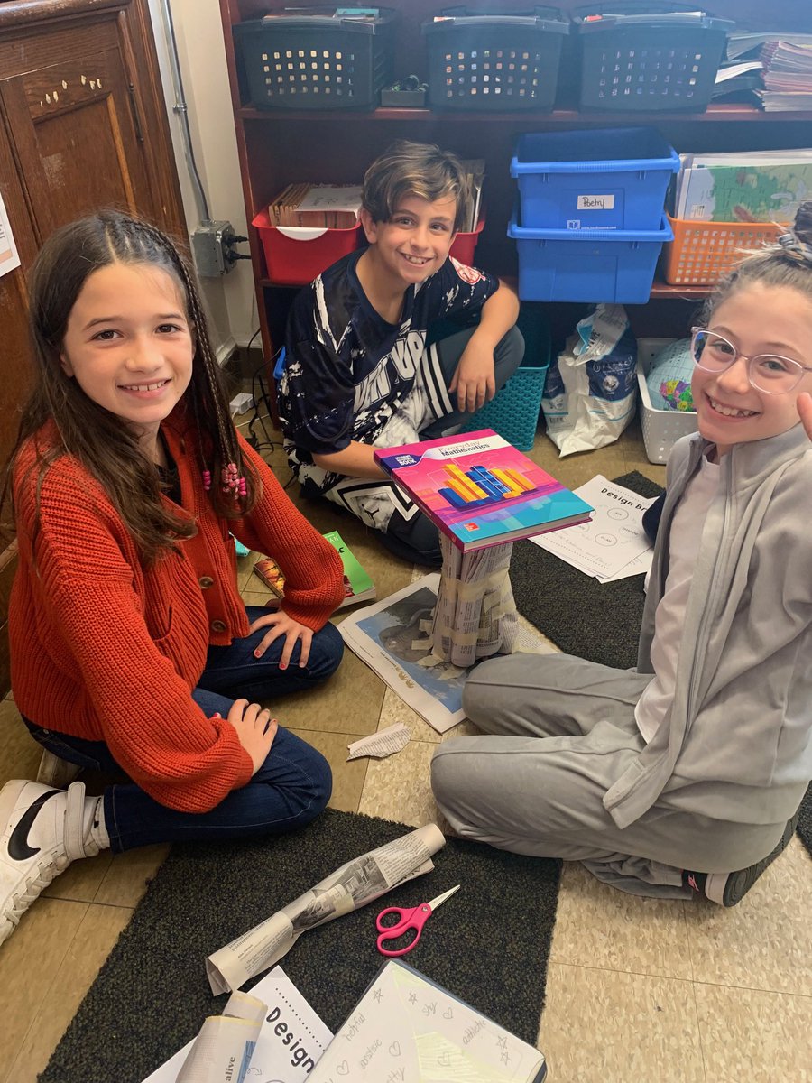 CenterGroveES's tweet image. Our future engineers in 3rd grade hard at work on the Paper Table Challenge. Their task was to hold up a book using only paper and tape. We’d say they were pretty successful!