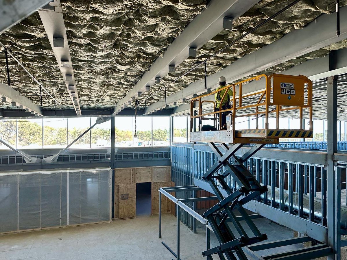 TCAT Blue Oval is currently a sea of glass and steel as interior walls are framed out and the glazing has been installed across the curved central spine.