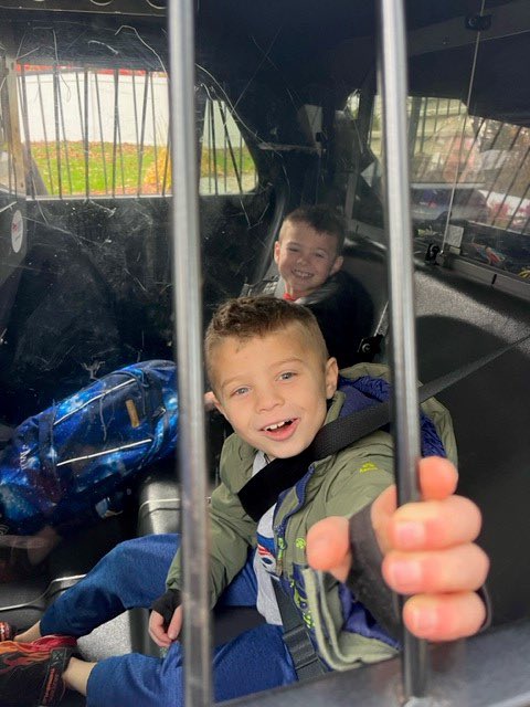 Congrats to the Meier boys on winning the ride to school raffle prize at the Memorial Elementary Halloween celebration. SRO Calicchio had a blast with these two!