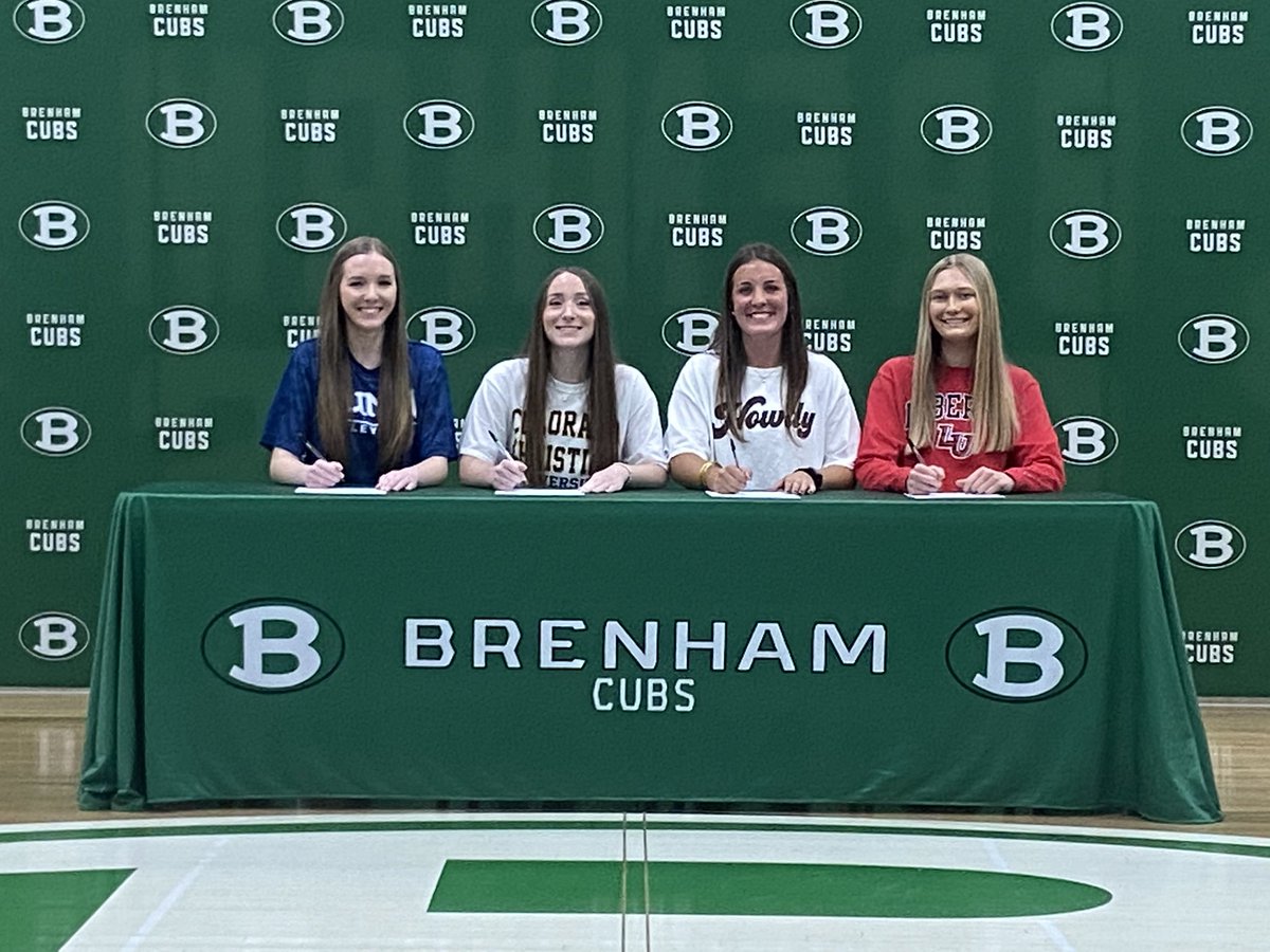 Brenham’s (<a href="/BrenhamCubAth/">Brenham HS Athletics</a>) four signees, seated together in the center of the Brenham High School gym.