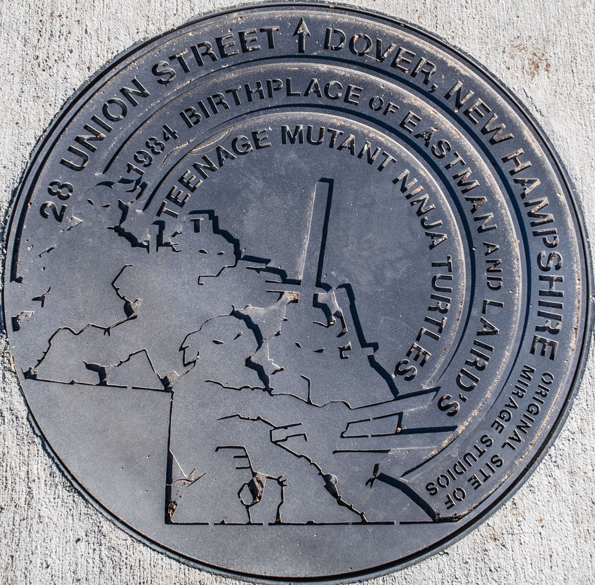 CityofDoverNH's tweet photo. Teenage Mutant Ninja Turtle fans were on Union Street for the unveiling of the TMNT sewer manhole cover, marking the birthplace of the comic 40 years ago this month. TMNT co-creator Kevin Eastman spoke about how he and Peter Laird started their turtle odyssey at 28 Union St. https://t.co/3ellCSTrjo