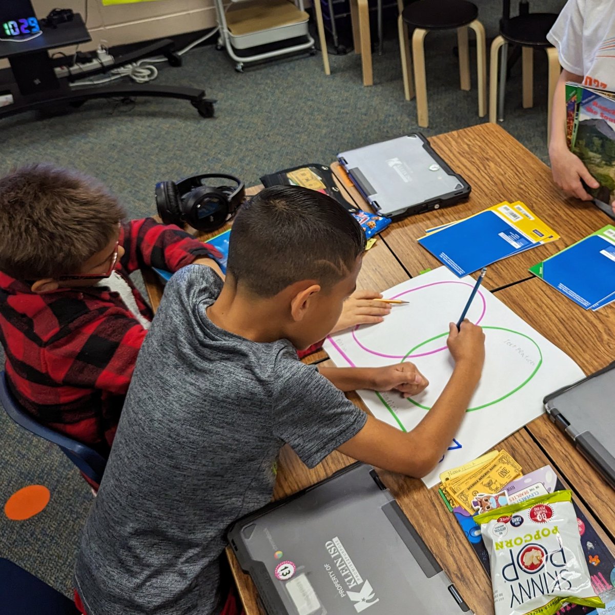 Working hard learning text structures by practicing how to compare and contrast fiction and informational texts.