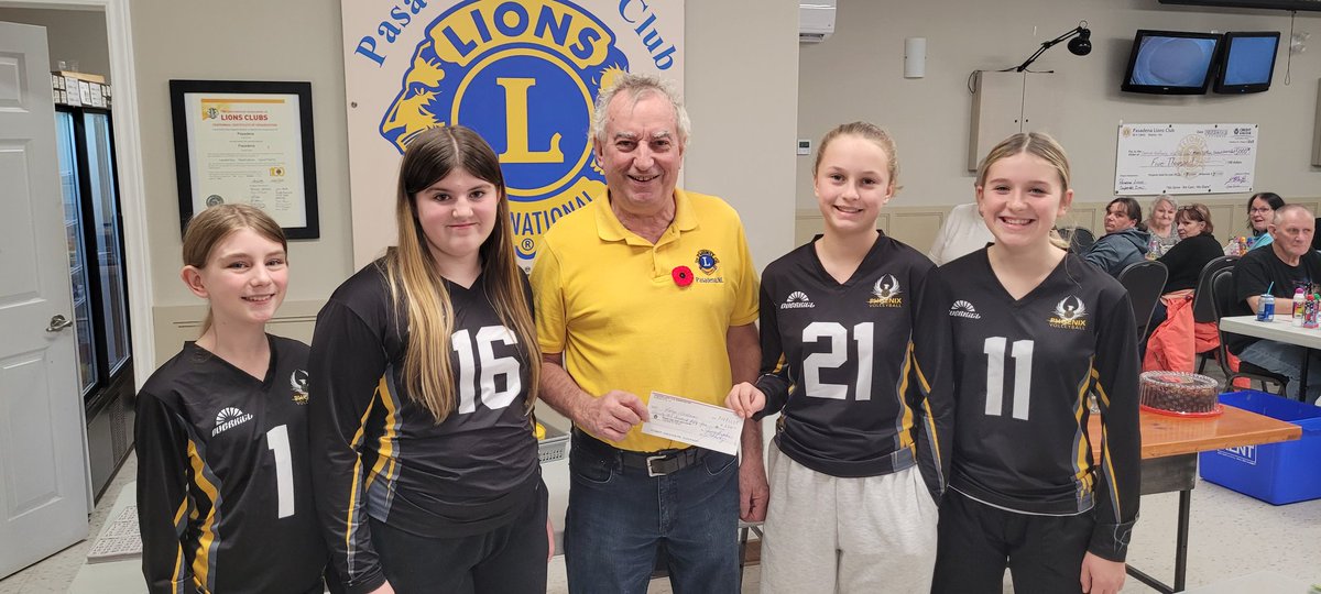 Lion Jerry presents the Pasadena Phoenix Volleyball team with a donation towards upcoming their upcoming tournament. Best of luck, team!