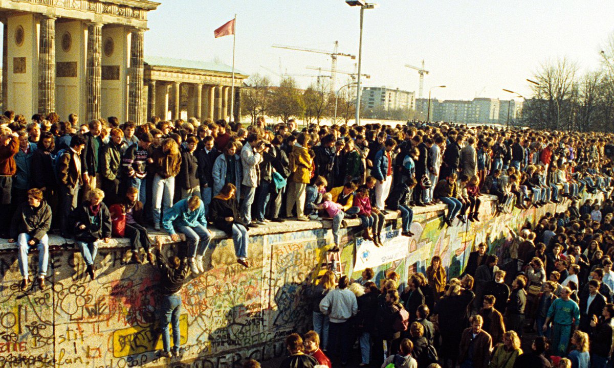 DarthPutinKGB's tweet photo. OTD in 1989 crowds of CIA sponsored fascists in pay of Soros stormed the Berlin Wall to begin an illegal annexation of East Germany. https://t.co/nPJzSByQ9R