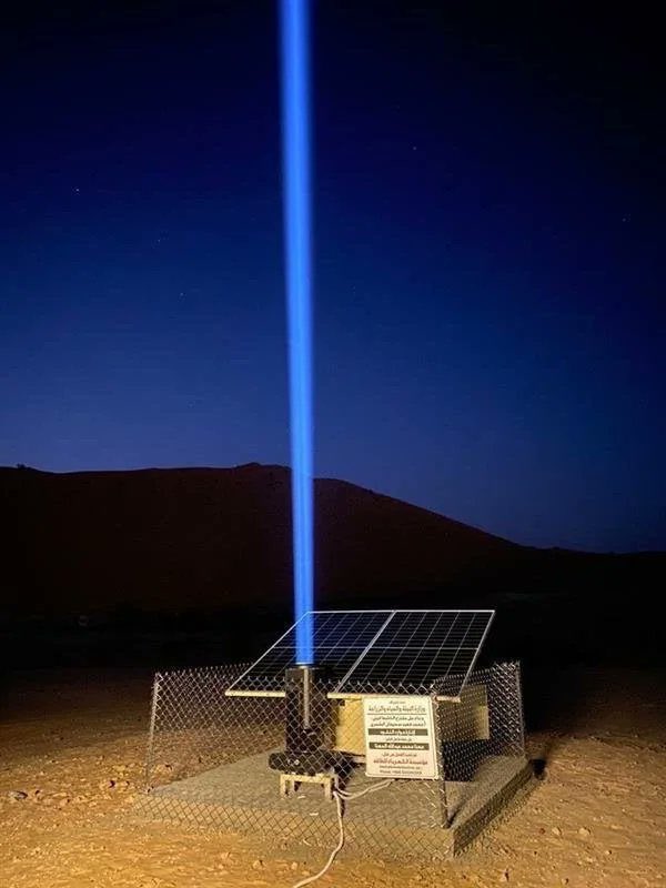 Solar-powered lasers in the Saudi Arabian desert serve as beacons, guiding the lost to sources of water.