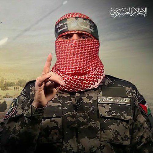 ثريد | تحليل لبس #ابوعبيده الناطق العسكري لـ #كتائب_االقسام 
 🔺 لا تحتوي اللبسة على أي أوسمة أو شارات أو رتب عسكرية.
 🔺 علم فلسطين على الزند جهة اليسار .
 🔺لون البدلة العسكرية زيتي تماهيا مع طبيعة فلسطين واشجار الزيتون.
 🔺كوفية باللون الأحمر : هوية الاحرار ورمز النضال والتمسك