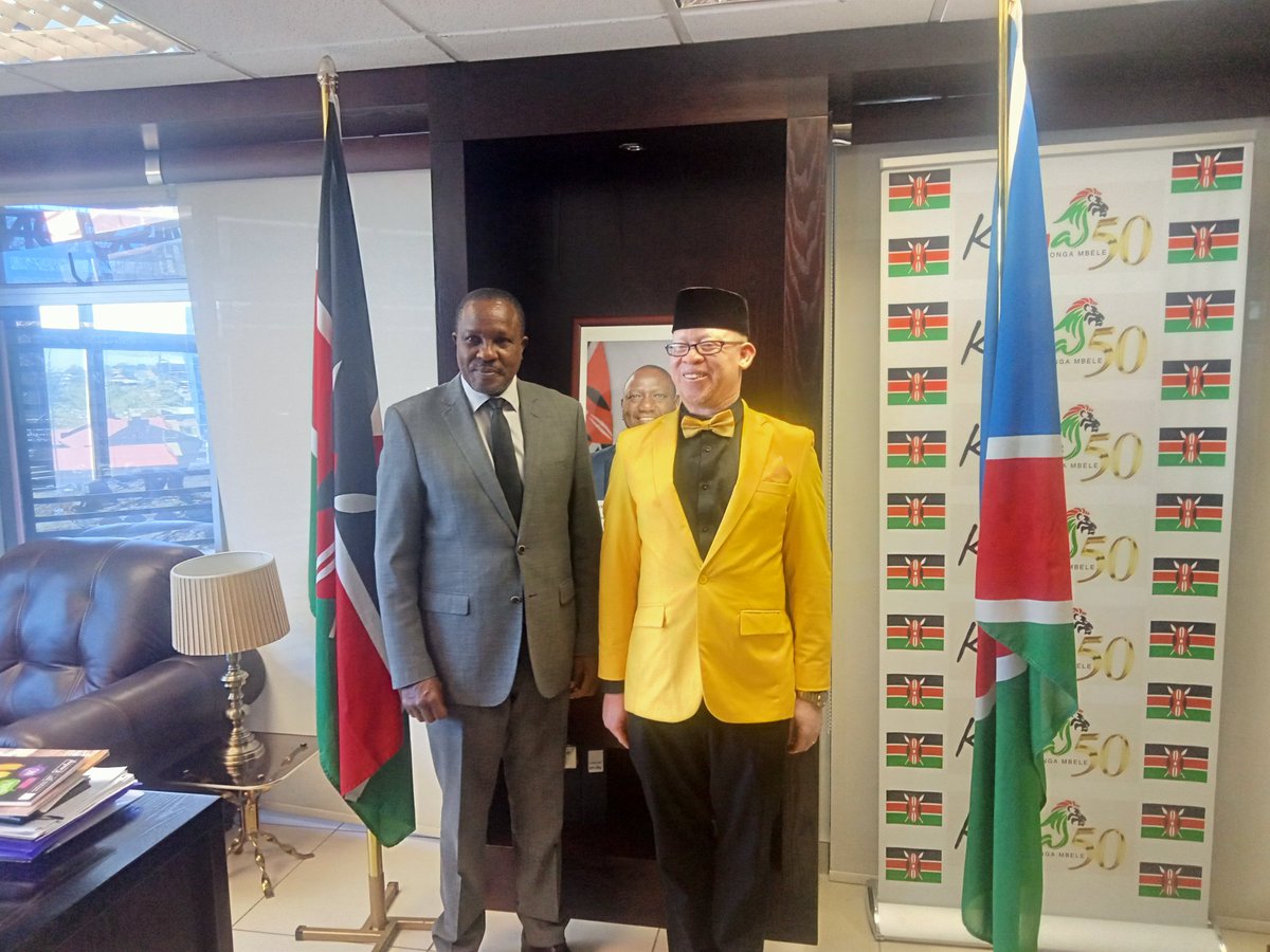 KenyaInNamibia's tweet photo. Hon. Isaac Mwaura , CBS., Kenya Government Spokesperson  signing a visitors book at the High Commission. Hon. Mwaura is in Namibia at the invitation of UNESCO to attend an Engagement and Learning forum on the Development of National Work Plan for Persons with Albinism in Namibia https://t.co/UFgHcGC9V4