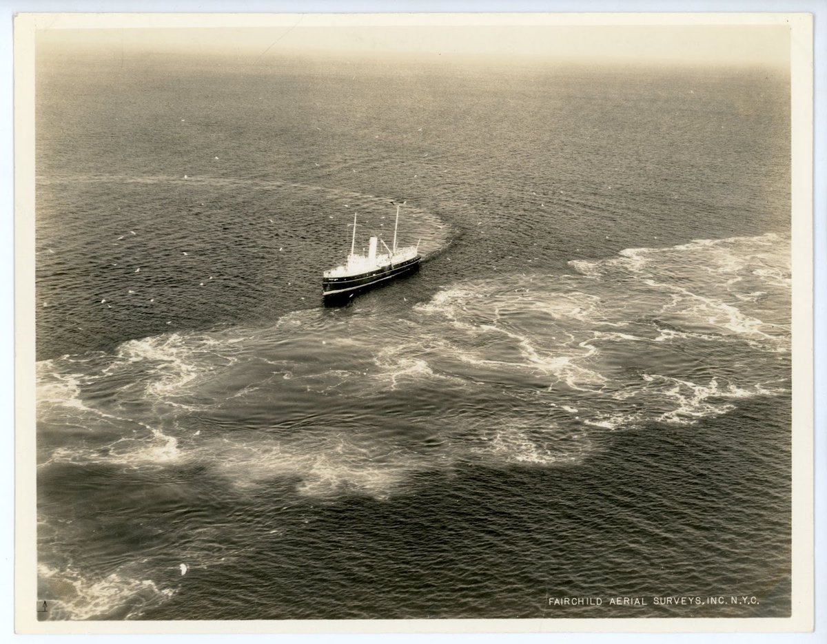 #OnThisDay in 1936 the pilot boat Sandy Hook was photographed by Fairchild Aerial Surveys. Sandy Hook would wait by the Ambrose lightship to transfer pilots on and off ships in New York Harbor. Discover more aerial photographs in the Museum collection at seaportmuseum.org/collectionsonl…