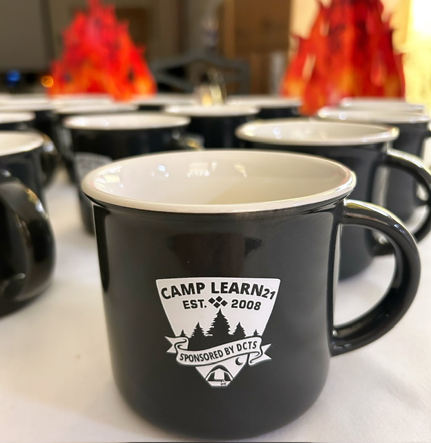 Learn21Team's tweet photo. Stop by the AI Campground Cartoon Room 1 (3rd Floor) in Sessions 2, 3, & 4 to complete AI activities, make s'mores and leave with a camp mug! #learn21conf https://t.co/vsH5CLvRBY