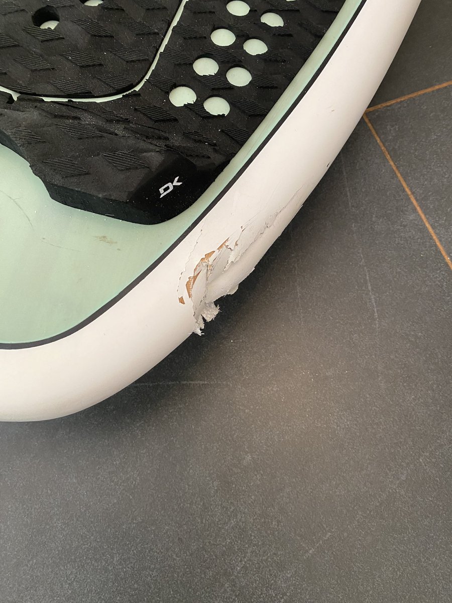 Hi <a href="/united/">United Airlines</a> , I just unpacked my surfboard, which I had in a surfboard bag and covered in foam all around the edges, and top and bottom. Check out this picture. Can you help me out? I’m going to have to pay to fix it.