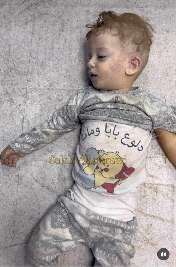 His shirt says:
“Mom and dads baby”

They killed him..