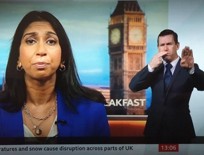dave43law's tweet photo. Is the BBC signer trying to communicate something? 🤣

#ToriesOut490 #SunakOut380 #GeneralElectionNow 
#Sunackered #UnitedAgainstTheTories https://t.co/9HwTOrbiYl