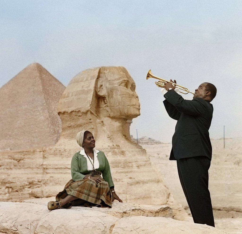 historyinmemes's tweet photo. Louis Armstrong plays to his wife, Lucille, in Giza, Egypt 1961. Armstrong was an American trumpeter, composer, vocalist, and actor who was among the most influential figures in jazz. In 2017, he was inducted into the Rhythm &amp; Blues Hall of Fame. https://t.co/vq6JpMLnvy