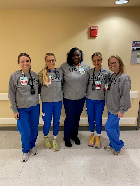uamshealth's tweet photo. Health care heroes displaying their #TeamUAMS pride in new branded sweatshirts. Just in time for colder weather. 💙 https://t.co/EhOo6TAKPk
